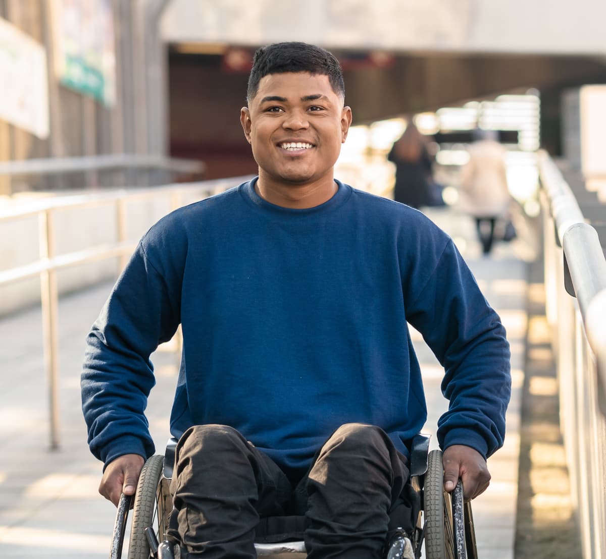 Man in wheelchair smiling